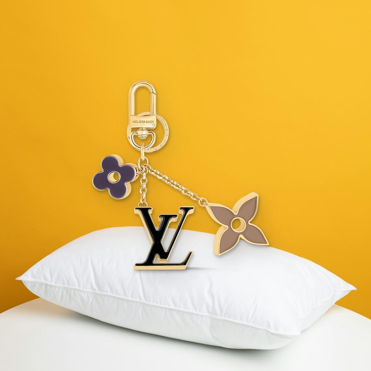 Fleur de Monogram Bag Charm - In-Hand Scale View | Eluxsic Luxury Charm